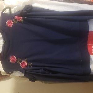 Relativity Sweater with cut off shoulders, dark navy with rose detailing.